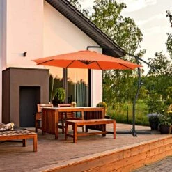 Curvy 11 Ft. Steel Large Cantilever Patio Umbrella With Sandbag And Cross Base In Orange